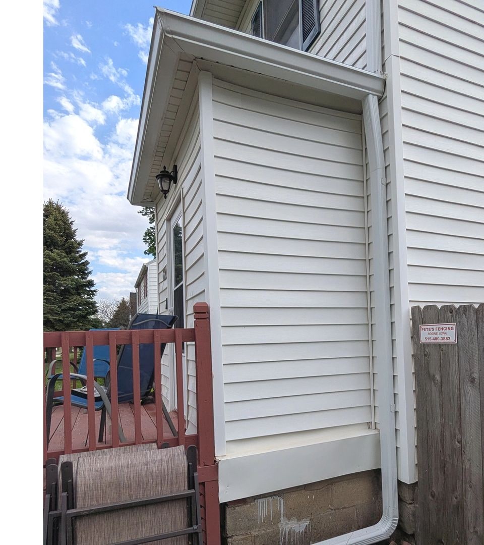 Siding after exterior cleaning with visible buildup removed.